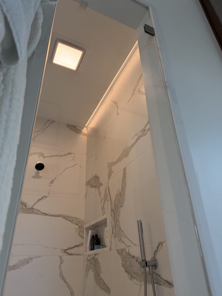 Shower glass restoration with marble surround in Nassau County, Florida